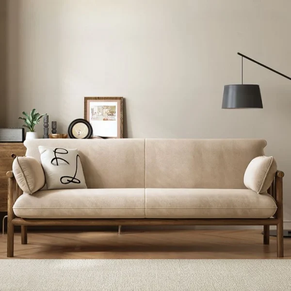 ADOUER WOOD Beige sofa with decorative pillows in a living room setting